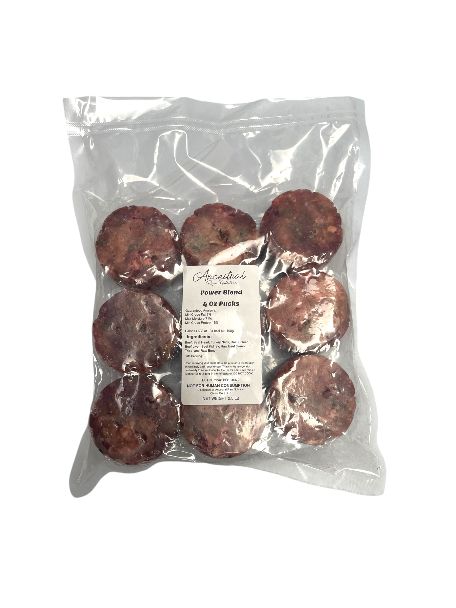 Frozen pucks of raw Power Blend with green tripe in vacuum-sealed bag