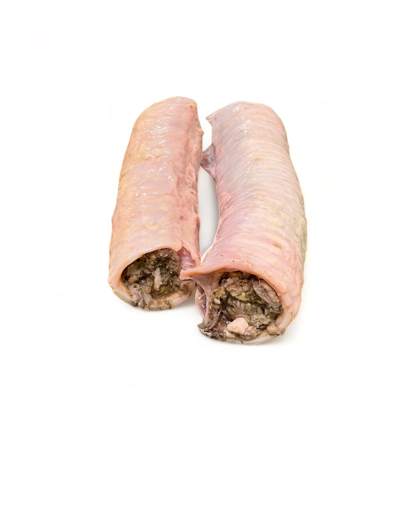 Close-up of raw beef trachea stuffed with green tripe