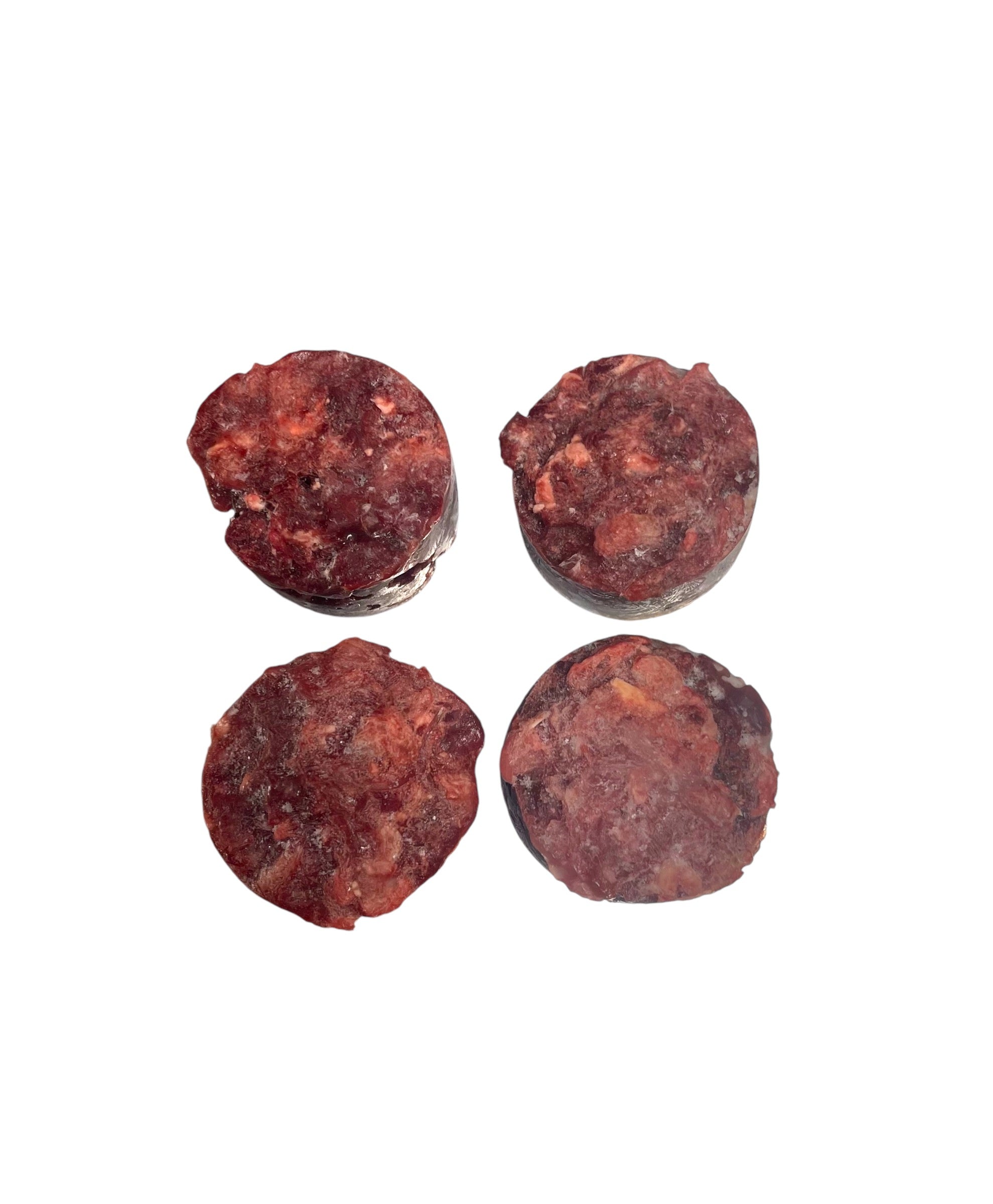 Chunky raw dog food pucks with visible beef and chicken mix
