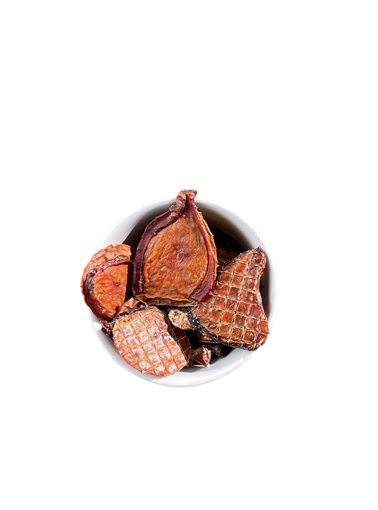 Dehydrated bull testicle pieces arranged in a bowl